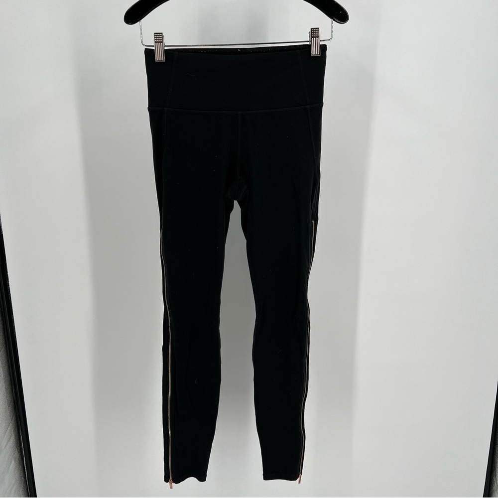 Athleta Black Leggings with designs on the side